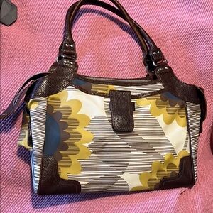 Orla Kiely bag. Coated canvas with leather trim. Clean lining.